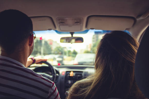 istock Couple driving in a car 1387091137