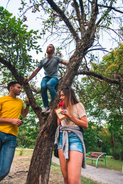 istock Young people fooling around in the park 1387091458