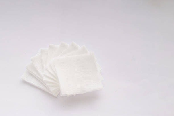 istock Pile of pad gauzes on white background 1387094787