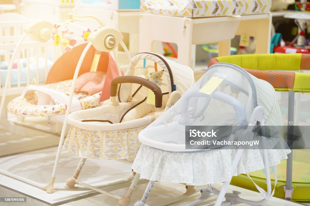 Baby crib or cot with cover in shop for sell Apartment Stock Photo