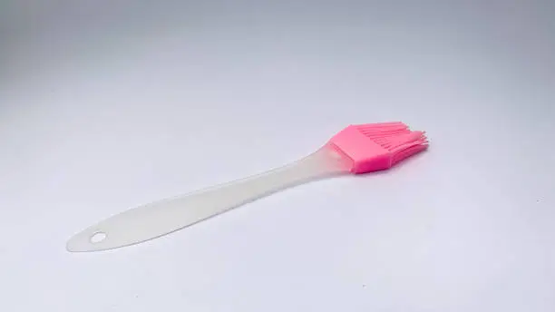 food brush with pink color on a white background
