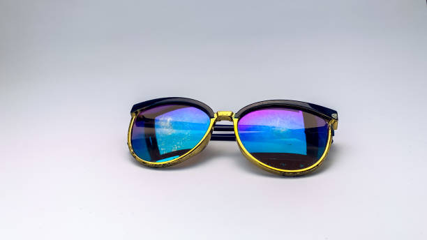 istock glasses with rainbow glass on a white background 1387096589