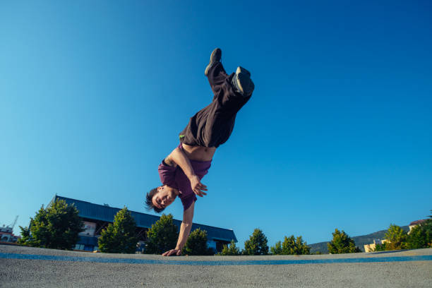 istock Well built person doing a handstand 1387097802