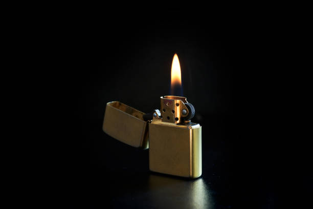 istock Old Metal Flint-wheel Lighter on dark background 1387097901