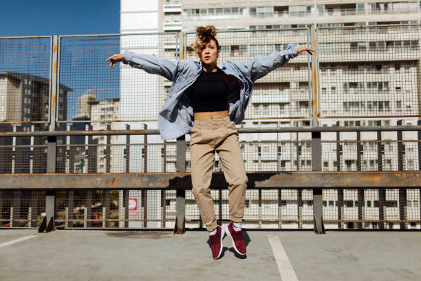 istock Dancing young woman 1387102535
