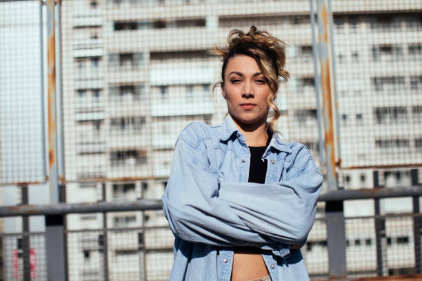 Portrait shot of cute urban girl with hands crossed