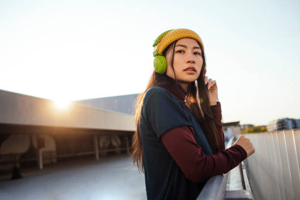 istock Asian girl on rooftop 1387103152