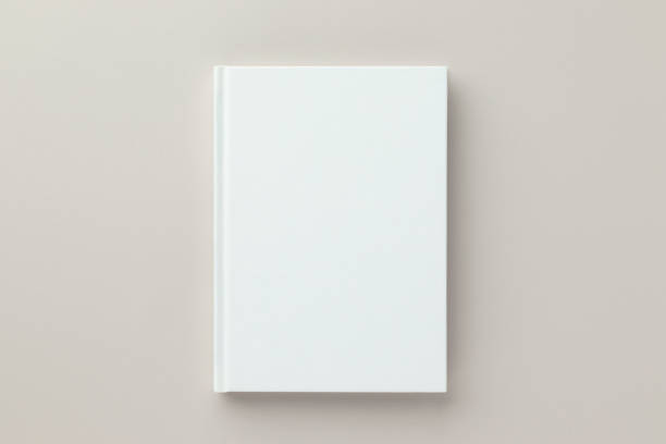 istock White book blank cover mockup on a beige background, flat lay, mockup 1387105124