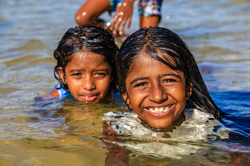 Sri Lankan young girls having fun in the sea, Sri Lanka