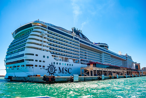 MSC Fantasia cruise ship at Palma, Majorca Habor, view from the right side and back, entire ship during daylight with clear sky, view from low angle
