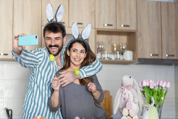 istock Beautiful young couple taking a selfie for Easter 1387107193