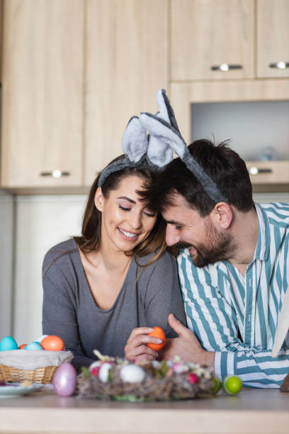 istock Attractive young couple wearing Easter bunny ears enjoying Easter day 1387107911