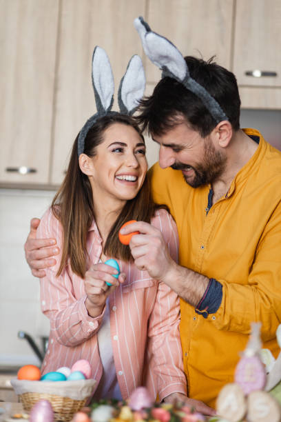 istock Young attractive couple cracking eggs as a part of Orthodox Greek tradition for Easter 1387108294
