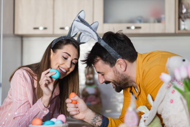 istock Young attractive couple cracking eggs as a part of Orthodox Greek tradition for Easter 1387108385