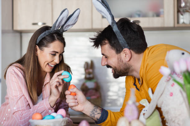 istock Beautiful young couple cracking eggs as a part of Orthodox Greek tradition for Easter 1387108399