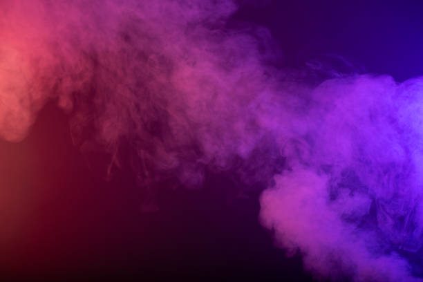 istock Black background with smoke colours 1387108425