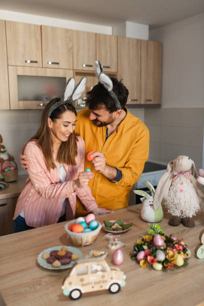 istock Attractive young couple cracking colorful Easter eggs as an Orthodox Greek tradition 1387109532