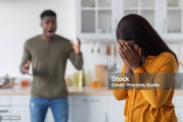 Psychological Violence Black Young Woman Covering Face While Boyfriend Shouting At Her Stock Photo - Download Image Now