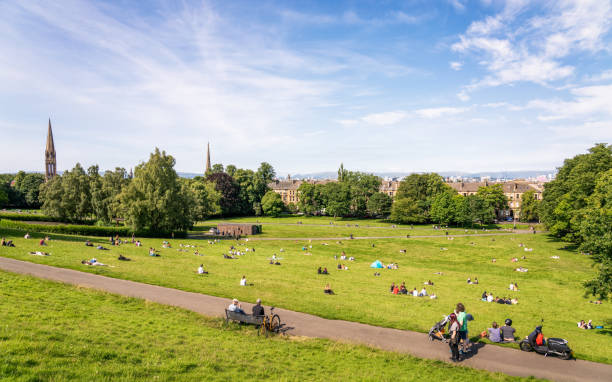 Weekend sunshine in Glasgow People making the most of a sunny summer's day in Queen's Park, in Glasgow's Southside. glasgow scotland stock pictures, royalty-free photos & images