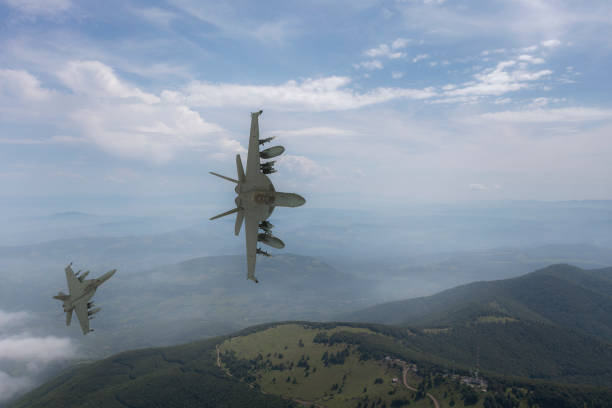 istock Jet fighters flying over the clouds. 1387111246