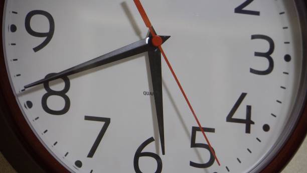 istock Wall clock with a light dial. Retro style. The movement of time 1387112250