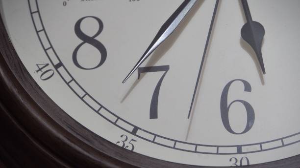 istock Wall clock with a light dial. Retro style. The movement of time 1387112284