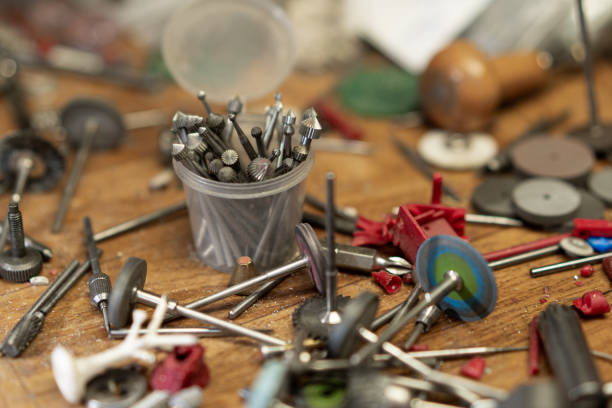 istock Front view of a set of various tools placed on a wooden desk in a workshop 1387114684