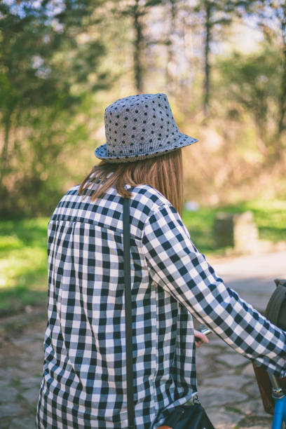 Close-up of young woman with bicycle