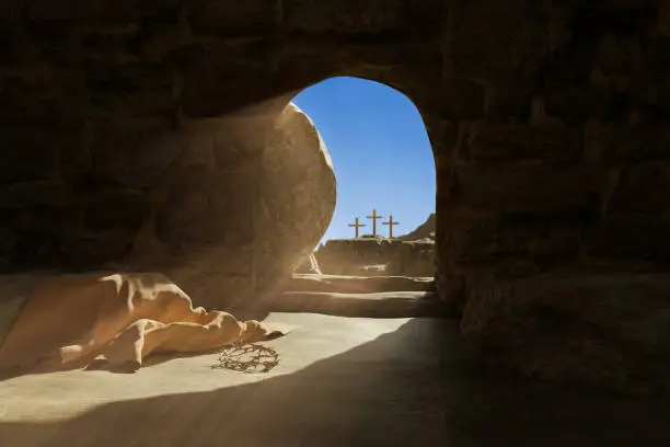 Photo of Resurrection of Jesus Christ. Bible story. The exit from the empty stone tomb is flooded with light. A thrown laurel wreath and a shroud on the floor. Religious Easter background. 3d render.