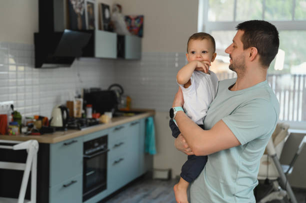 istock Father and son hugging in the kitchen 1387118712