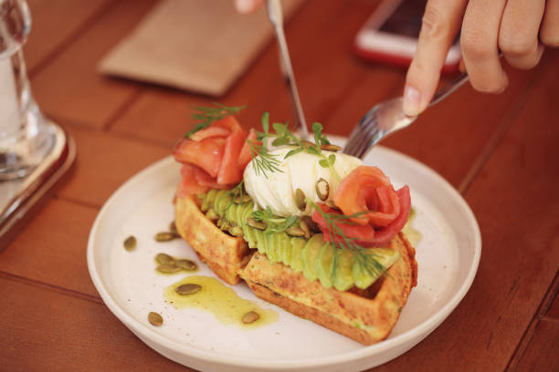 istock waffles with avocado and red fish are on the table 1387121769