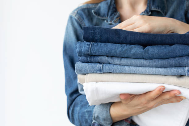 istock Woman Holding Jeans 1387123481