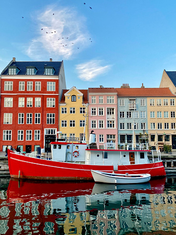 Copenhagen new haven aspect with a red wooden boat