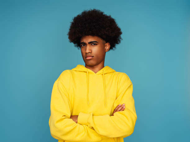istock African american man with afro hair standing over isolated  background 1387123798