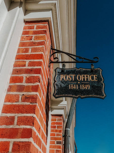 istock Vintage historical Post Office Hanging Sign 1387124383