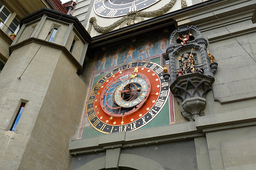 Bern, Switzerland - September 06, 2015: Medieval Astronomical Clock of the 13th century, installed on the Clock Tower east front (1191-1256), Zytglogge located at the end of the Kramgasse in Old Town. The City of Bern is one of the countless great places in Switzerland and it is the political centre of this Country. Numerous museums, a wide cultural offer, a variety of tourist attractions makes it a travel destination for tourists from all over the world.