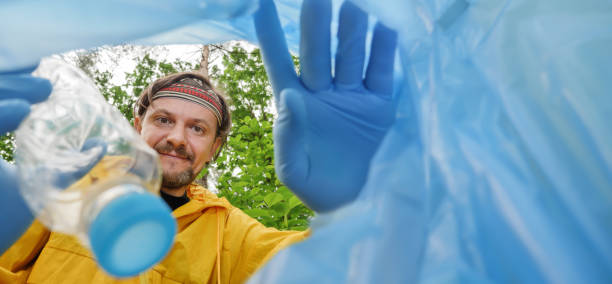 istock Join our team cleaning park clean up environment and plastic bottle pet waste. Donation charity volunteer park trash clean forest day of charity event cleaning environment friendly people volunteering 1387128134
