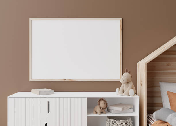 istock Empty horizontal picture frame on brown wall in modern child room. Mock up interior in scandinavian style. Free, copy space for your picture, poster. Close up view. Cozy room for kids. 3D rendering. 1387128619