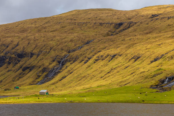 istock Sunset over a volcanic archipelago, Faroe Islands. 1387128801