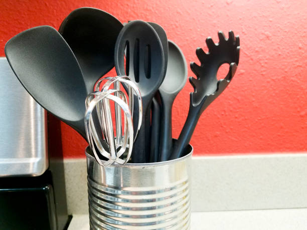 istock Cooking utensils sitting on counter in a domestic kitchen.  The container is a repurposed  vegetable can, adorned and sustainable. 1387129763