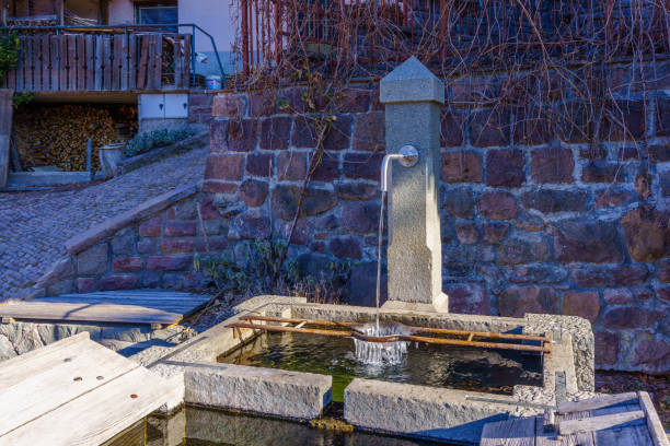 istock Water trough fountain, Dolomites mountains 1387130319