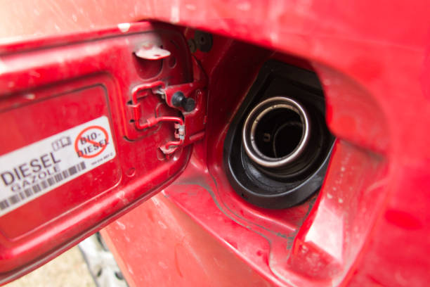 istock Red car fuel filler open. 1387132408