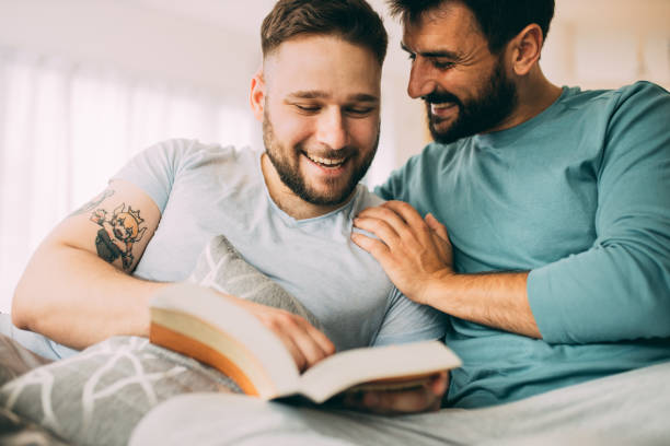 istock Gay couple in bed 1387135682