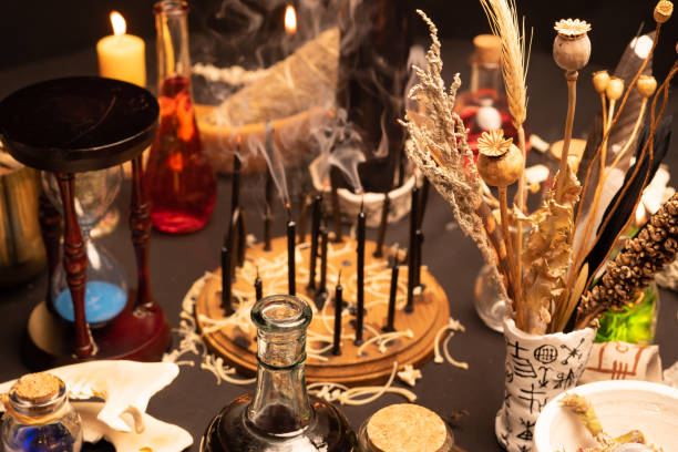 istock Witchcraft ritual ceremony, selective focus. Alchemy and esoteric symbol items for magic cult. Spiritual occultism and magic chemistry inspired by mysticism. Witch and warlock magician concept. Halloween. 1387135878