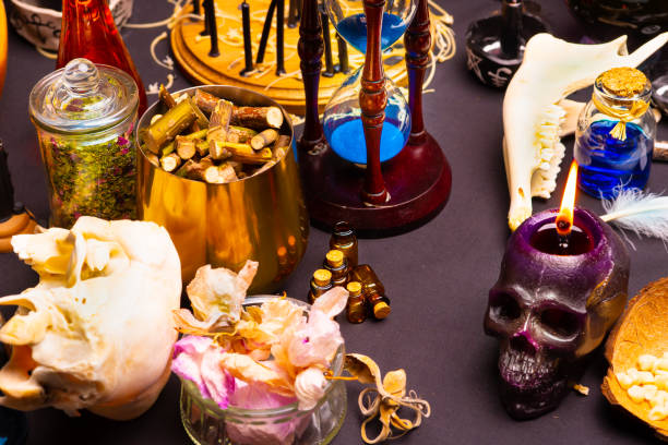 istock Witchcraft ritual ceremony, selective focus. Alchemy and esoteric symbol items for magic cult. Spiritual occultism and magic chemistry inspired by mysticism. Witch and warlock magician concept. Halloween. 1387138195