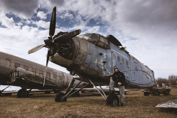 istock A young man poses in an airplane cemetery as an old-fashioned pilot 1387139627