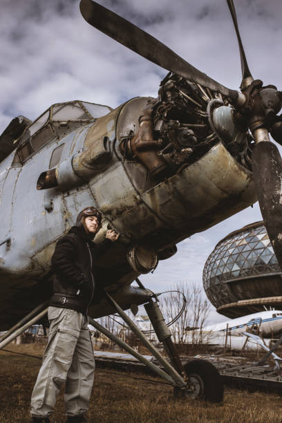 istock A young man poses in an airplane cemetery as an old-fashioned pilot 1387139629