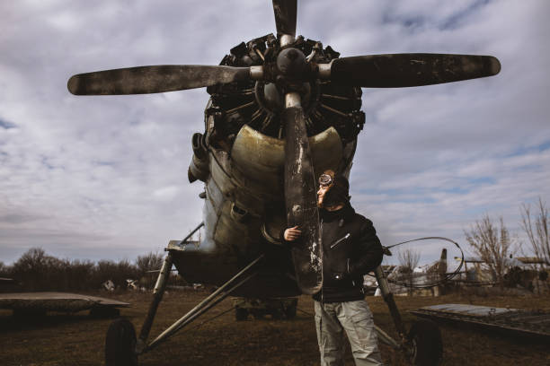 istock A young man poses in an airplane cemetery as an old-fashioned pilot 1387139631