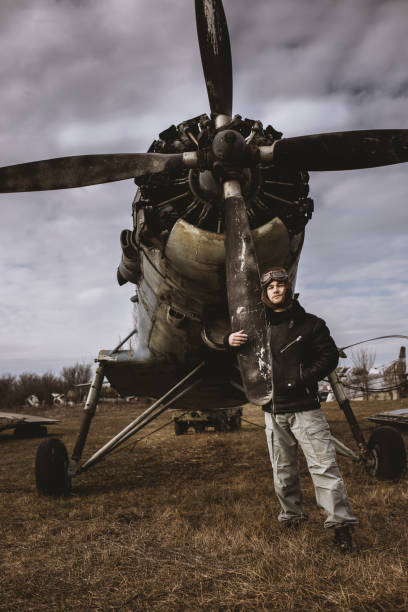 istock A young man poses in an airplane cemetery as an old-fashioned pilot 1387139668
