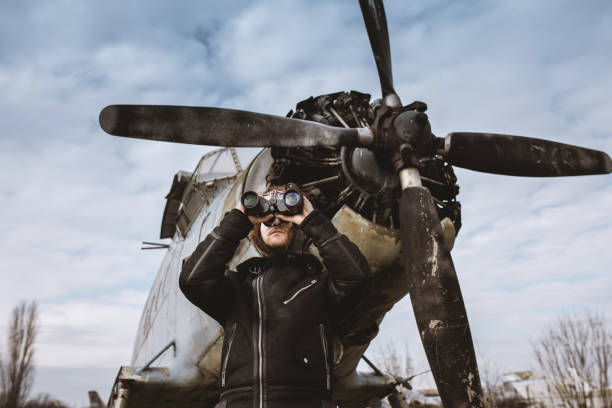 istock A young man poses in an airplane cemetery as an old-fashioned pilot 1387139721
